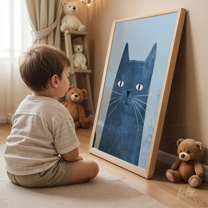 framed wall art featuring a blue cat illustration, leaning on the floor in a cozy setting surrounded by plush toys