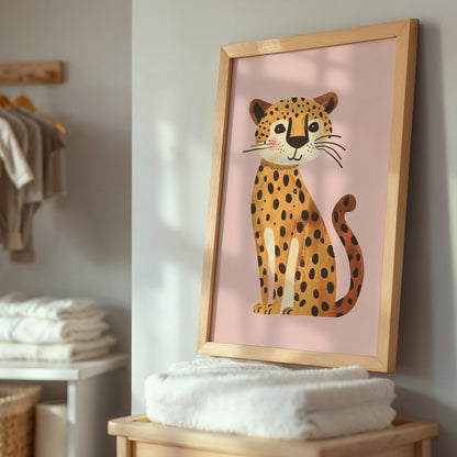 decorative artwork of a stylized leopard with pink background, in light wood frame, resting on a shelf with white towels