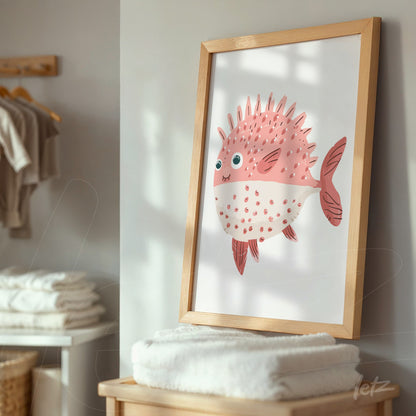 framed wall art featuring a pufferfish illustration with light wood frame against a neutral background