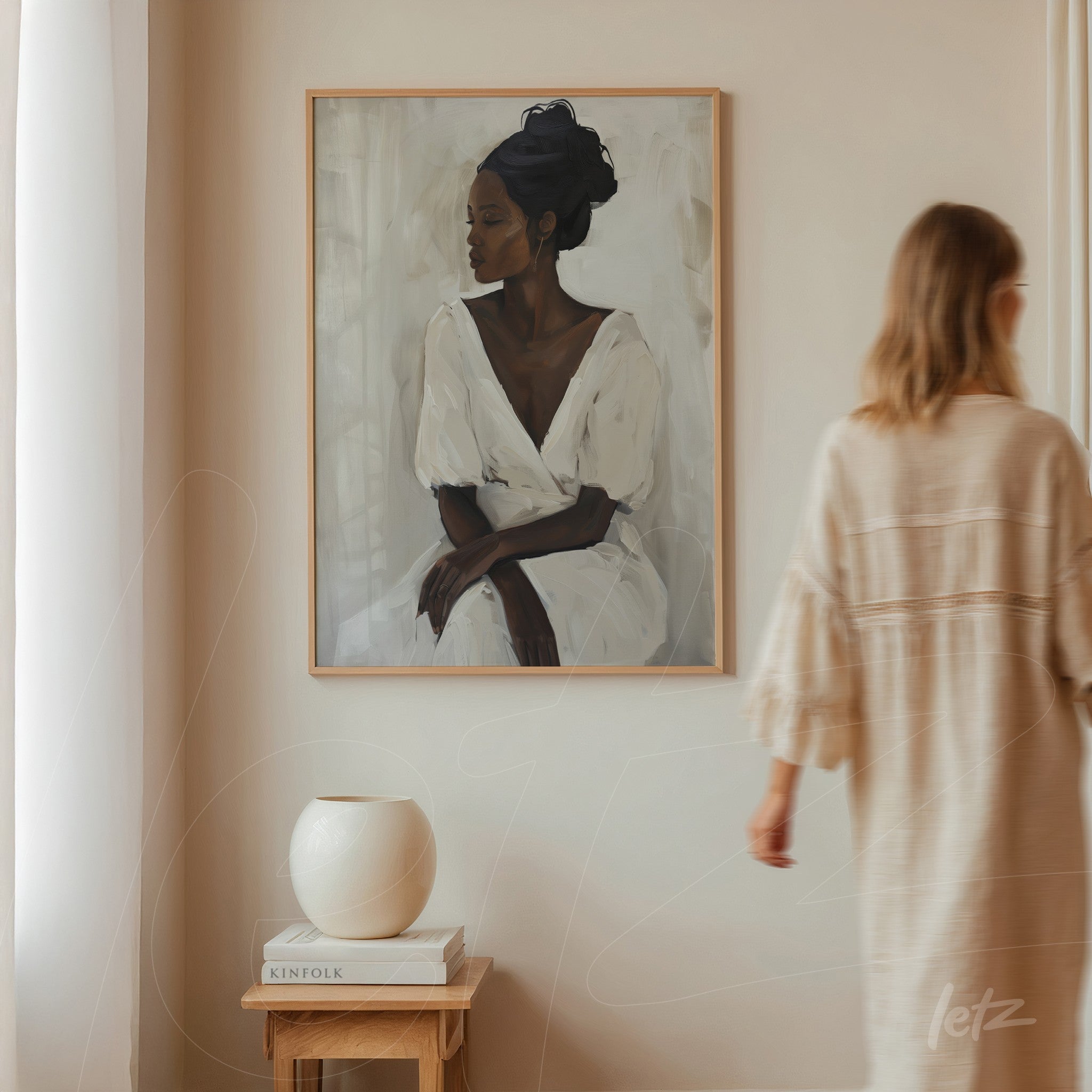 framed wall art featuring a contemporary portrait of a woman in a white dress, displayed on a neutral wall