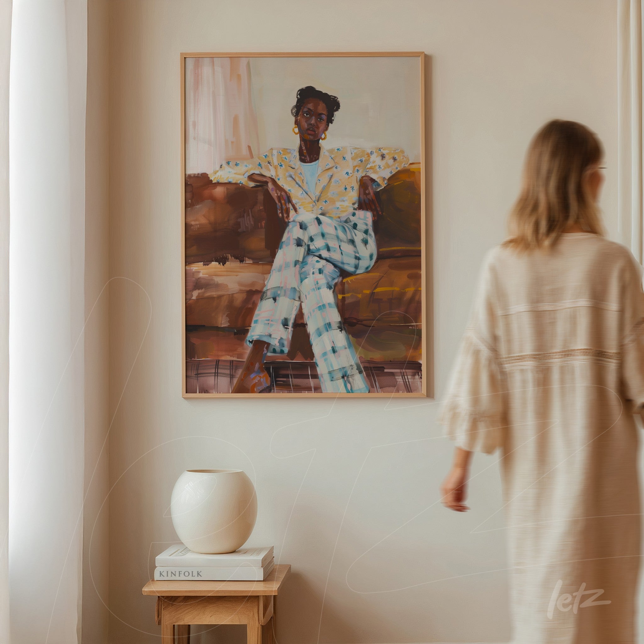 framed artwork of a stylized woman in polka dot suit displayed in a neutral room next to a modern vase