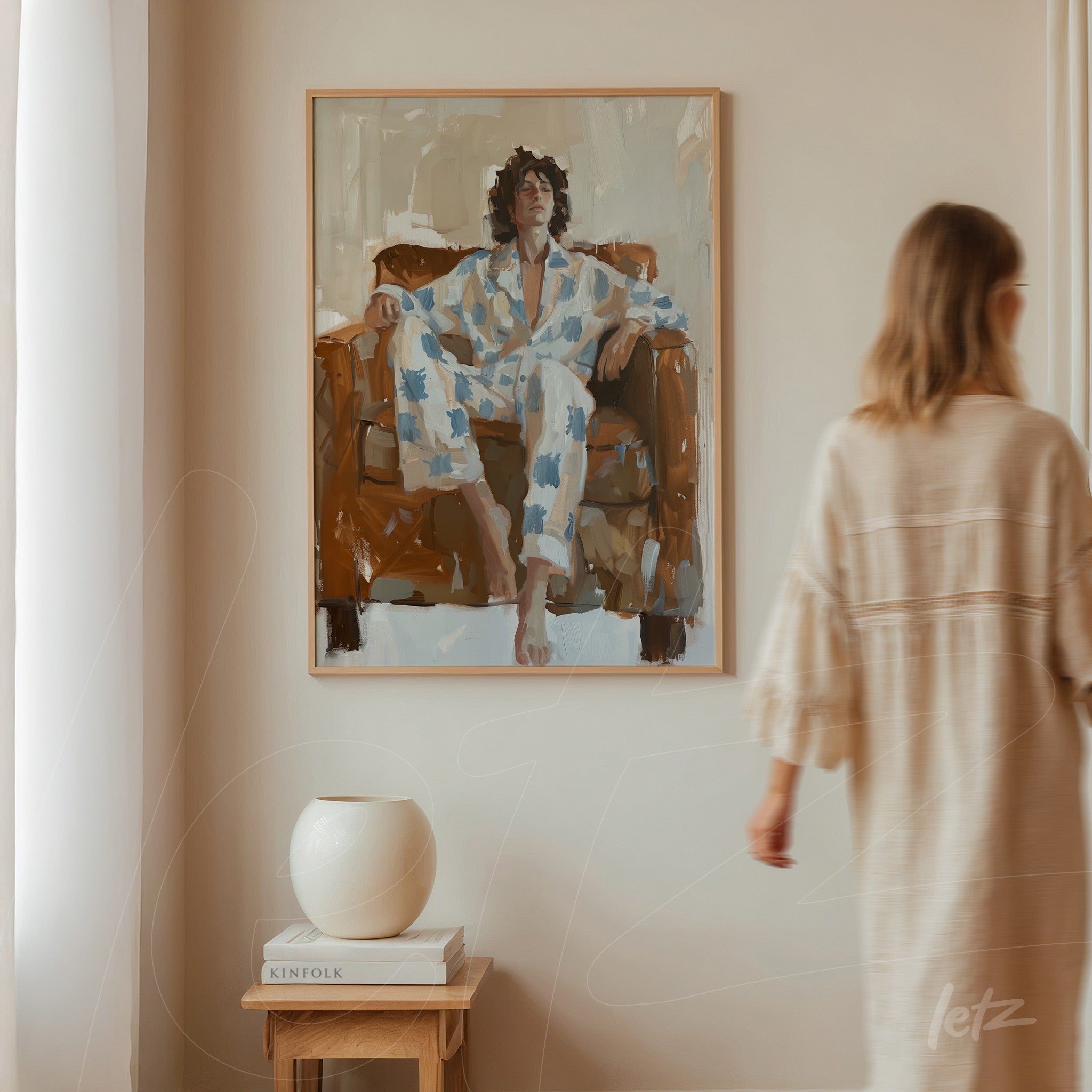 framed artwork depicting a seated figure in floral patterned loungewear on a brown sofa