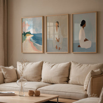 composition of contemporary art pieces featuring a beach landscape, seated female figure, and woman's portrait, framed in light wood against a neutral wall