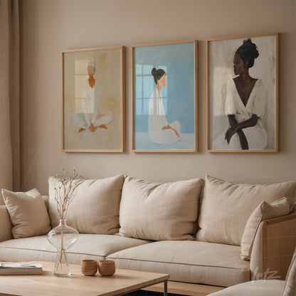 collection of framed minimalist portraits of women in light frames displayed on neutral wall next to beige sofa