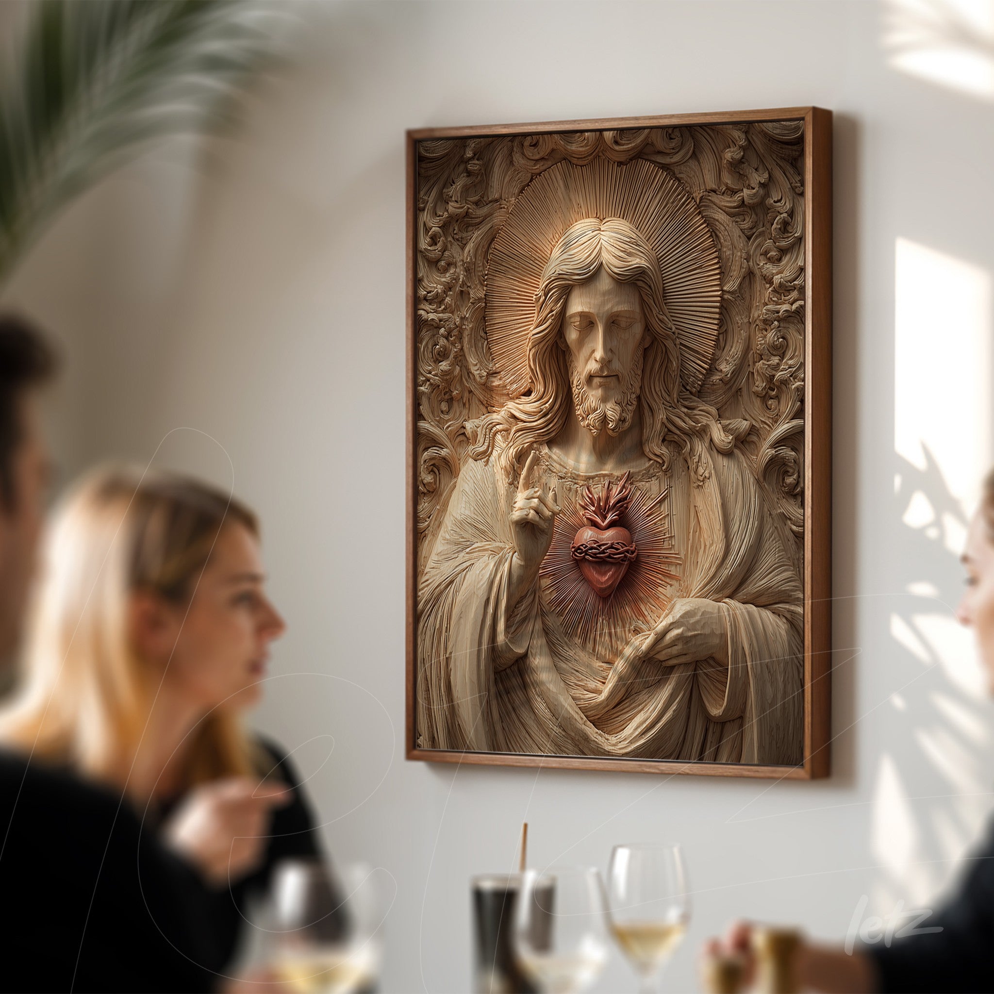 relief wall art of Jesus Christ with exposed heart in light wood frame displayed in a dining setting