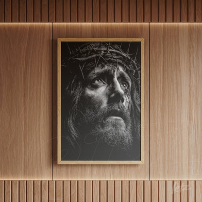framed wall art featuring a black and white depiction of Jesus with a crown of thorns on a dark background