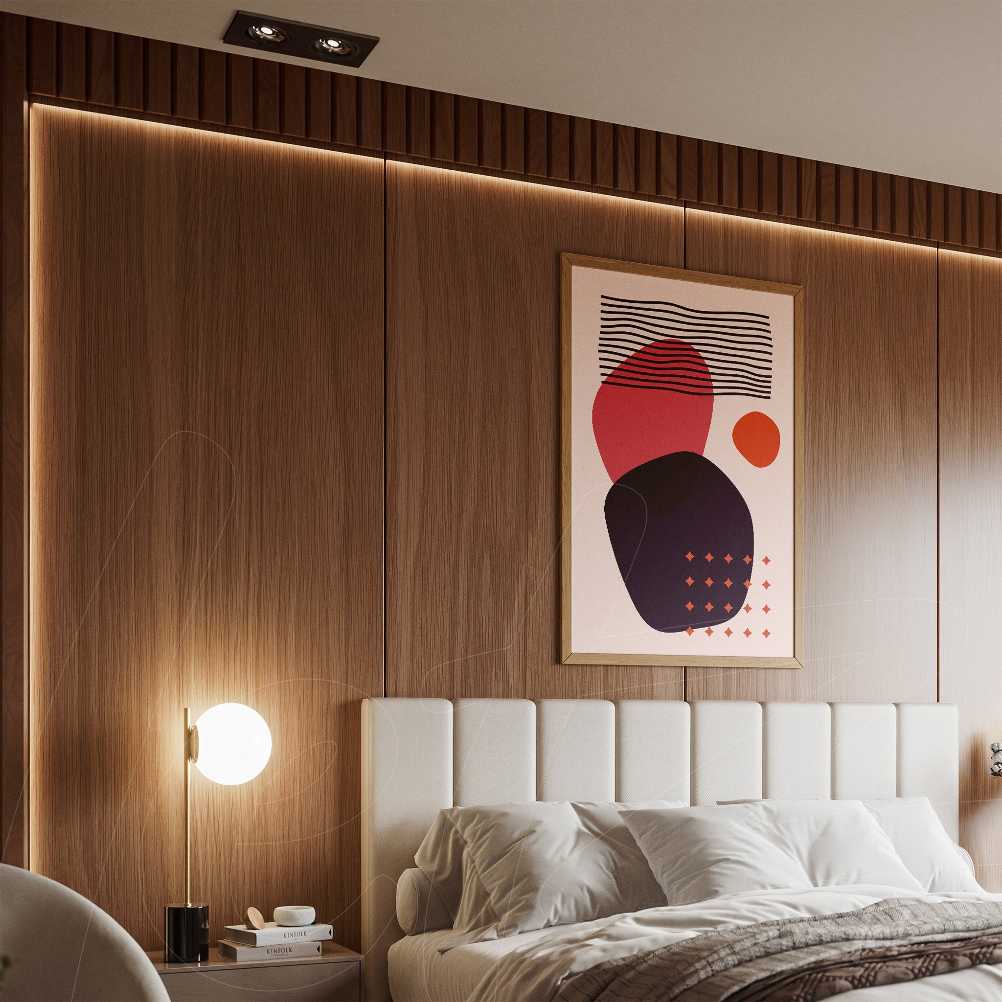abstract art print with colorful circles in a light frame, displayed above a bed with a white headboard