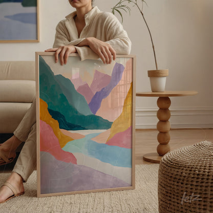 framed abstract landscape art in pastel colors displayed in a cozy indoor setting