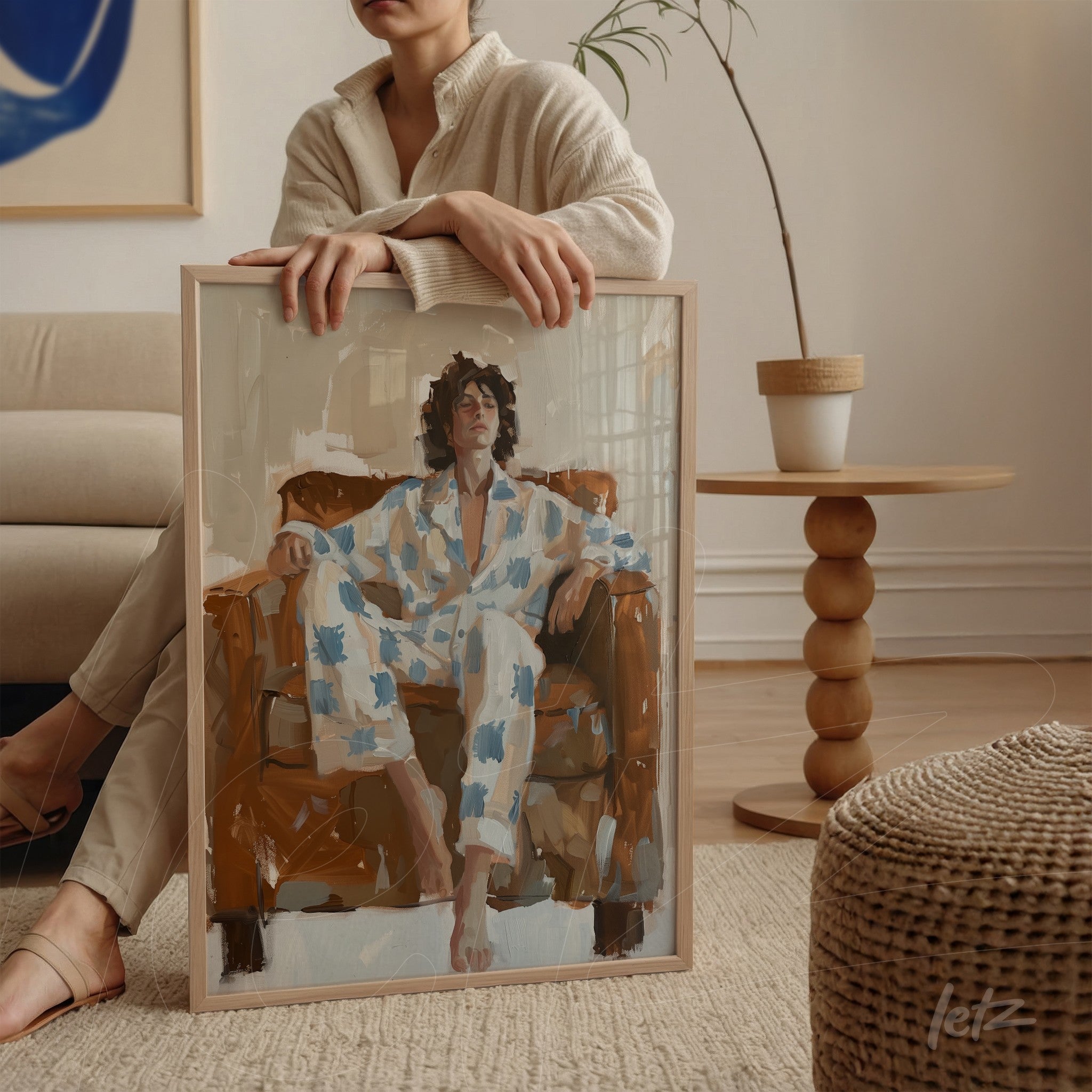 contemporary art print depicting a woman relaxing in a brown chair, light frame and neutral background