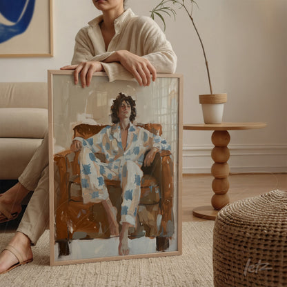 contemporary art print depicting a woman relaxing in a brown chair, light frame and neutral background