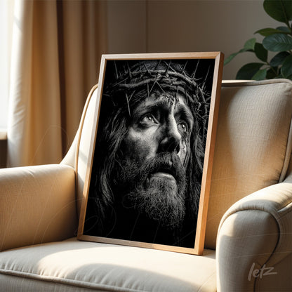 framed black and white portrait of Jesus Christ wearing a crown of thorns in light wood frame