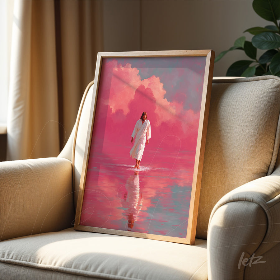 framed art of a solemn figure walking on water in pink hues with light wood frame