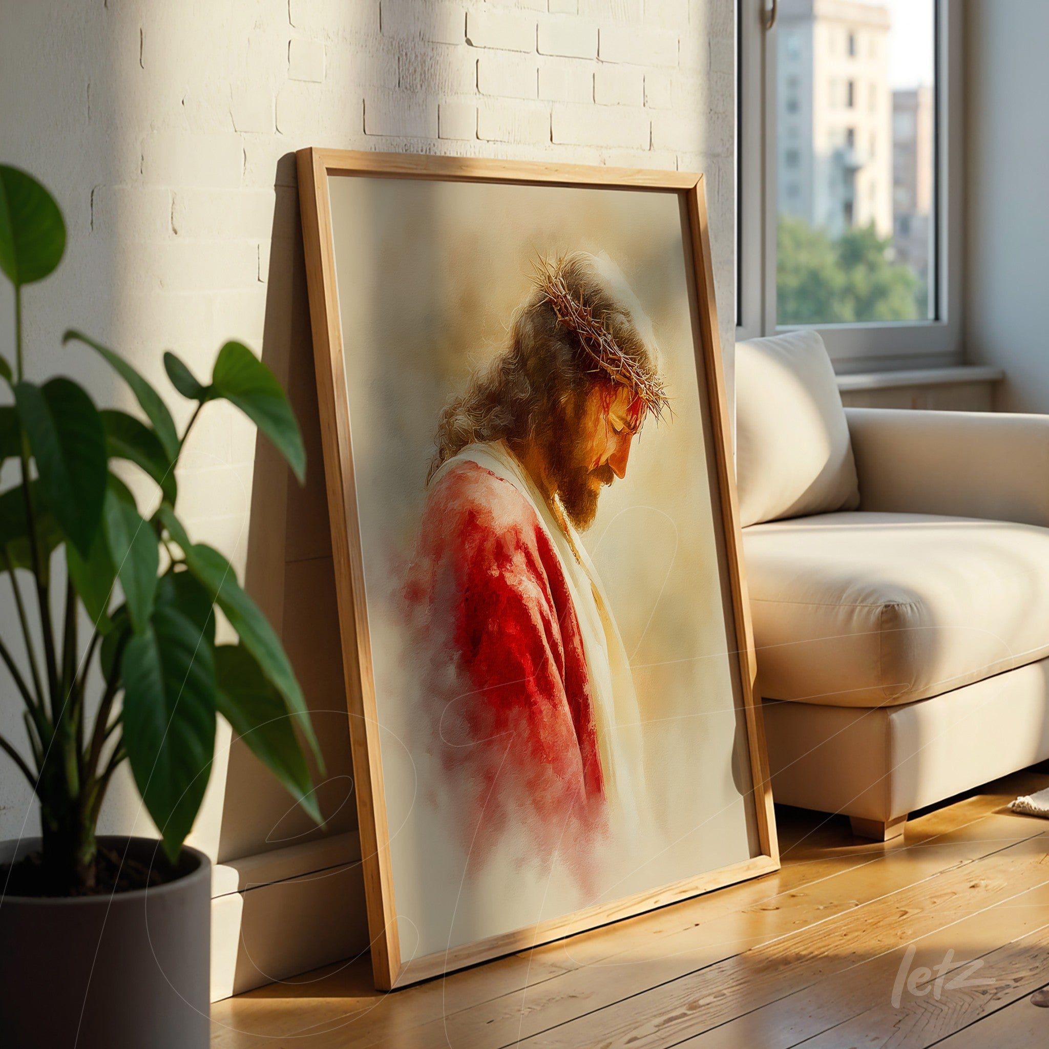 framed artwork depicting Jesus with long hair and crown of thorns, featuring a soft background and warm colors, leaning against a light sofa