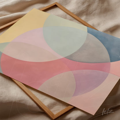 canvas art featuring abstract shapes in pastel colors with overlapping circles in pink, blue, and green, framed in light wood