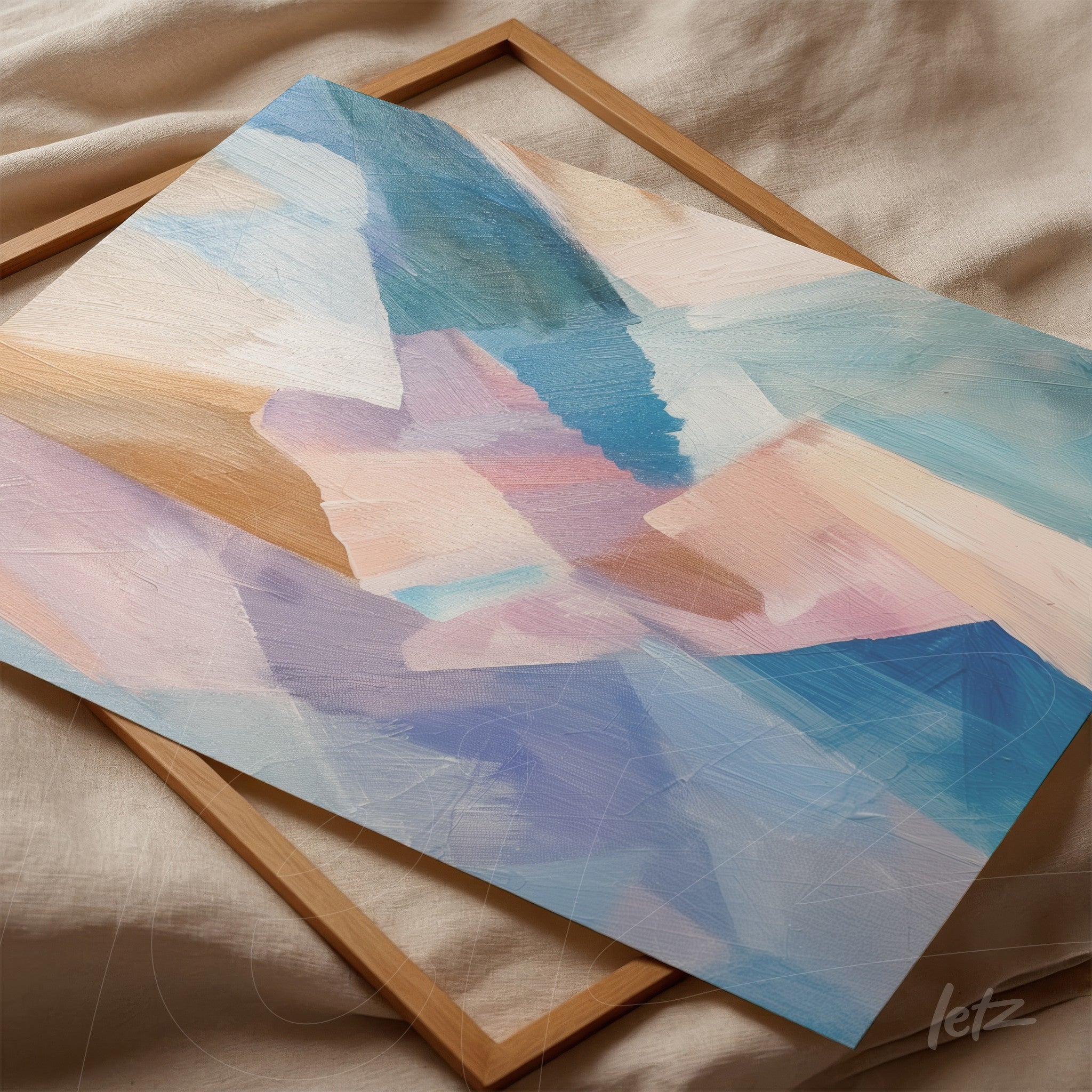 framed abstract art piece featuring soft shades of blue and pink with a light wood frame