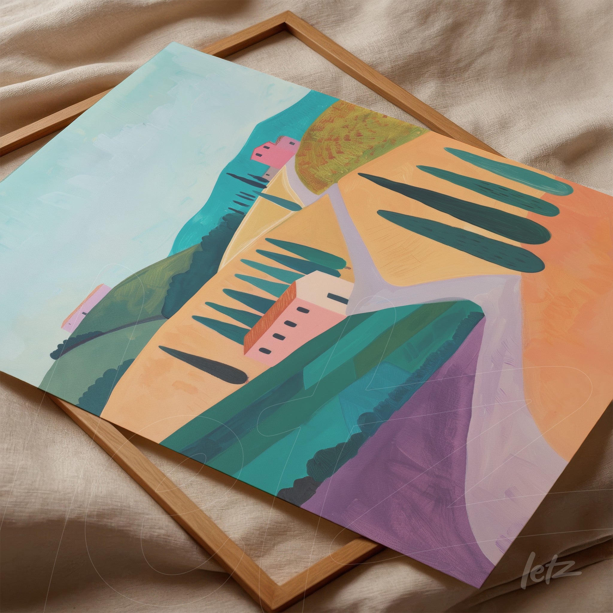 framed artwork depicting rolling green hills and yellow fields, featuring pink modern houses in a light wood frame