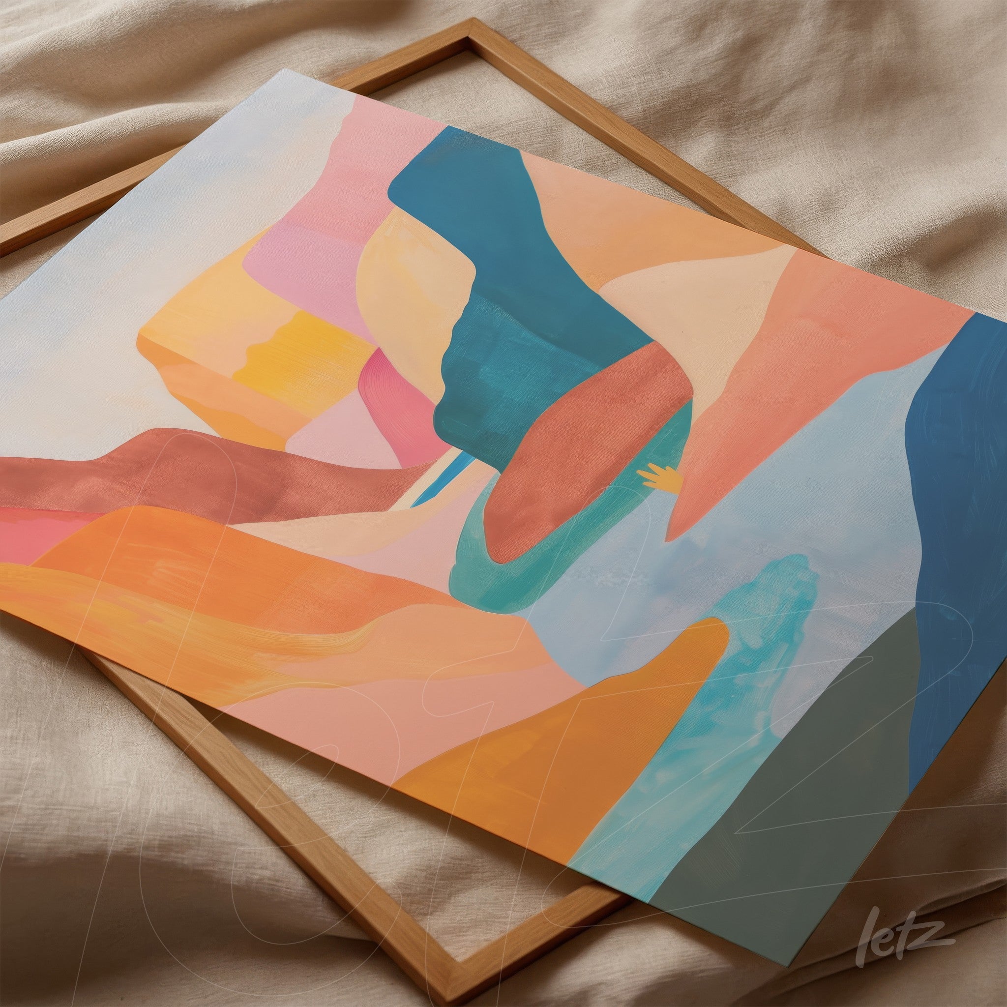 abstract art piece in shades of orange, pink, and blue displayed on light fabric with a wooden frame