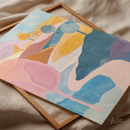 canvas art featuring abstract shapes in soft colors such as pink, yellow, and blue on a light background, displayed in a light wood frame