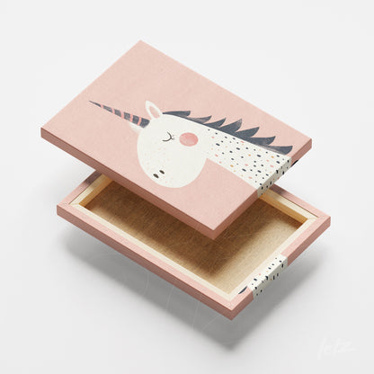 decorative box featuring unicorn design in light pink tones with striped detail on the lid