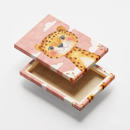 framed artwork featuring a cute lion illustration on a light pink background with decorative frame