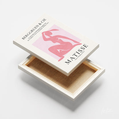 canvas print featuring henri matisse artwork of a female figure in pink on light background with white frame