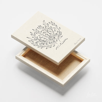 decorative box with minimalist art of a branch with leaves on light background