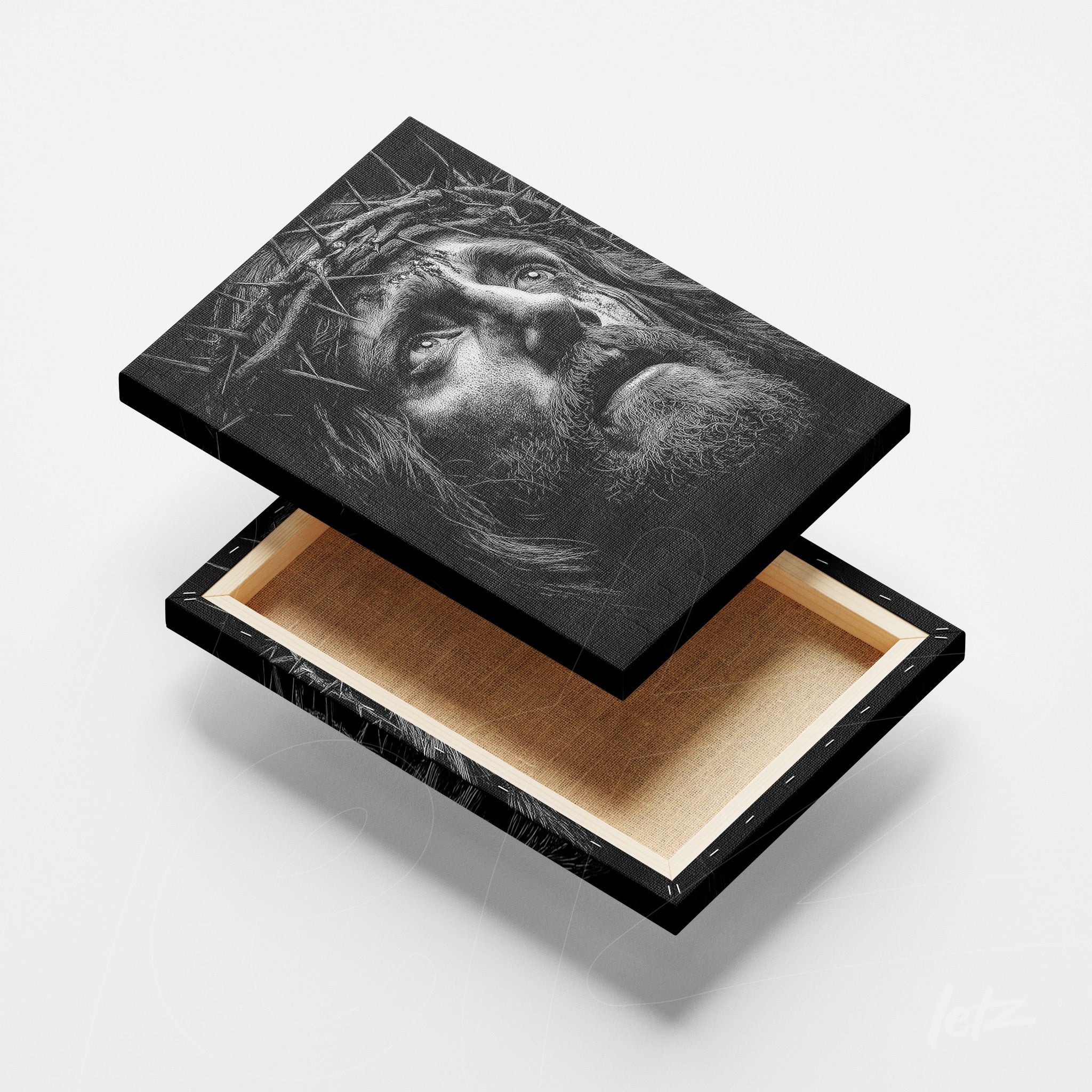 canvas print featuring a black and white portrait of Jesus Christ with a crown of thorns, framed in black