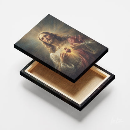 canvas art featuring jesus christ holding a heart, shown in a black frame