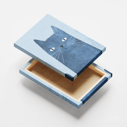 canvas art featuring a cat illustration in blue tones against a light background