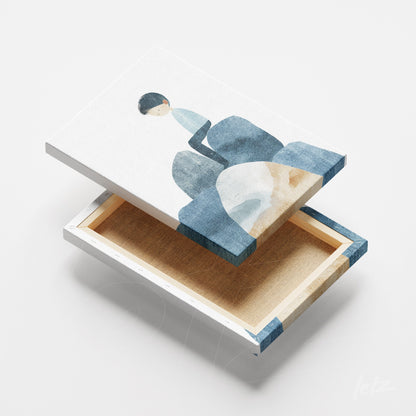 canvas artwork featuring watercolor illustration of a boy sitting on blue stones