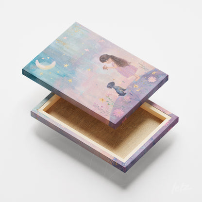 decorative box featuring whimsical art of a girl playing with a dog under a starry sky with a crescent moon