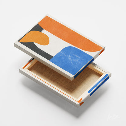 canvas print featuring abstract design in shades of orange, blue, and black on white background