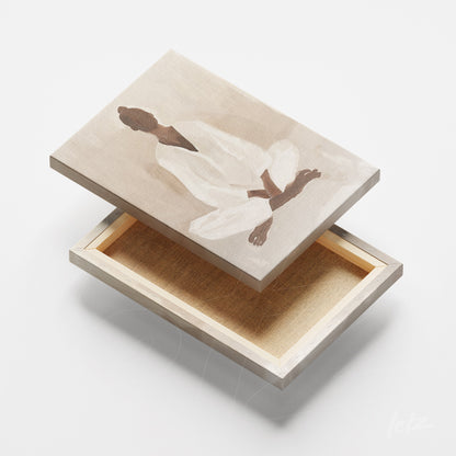 canvas print featuring abstract artwork of a meditating human figure on a neutral background