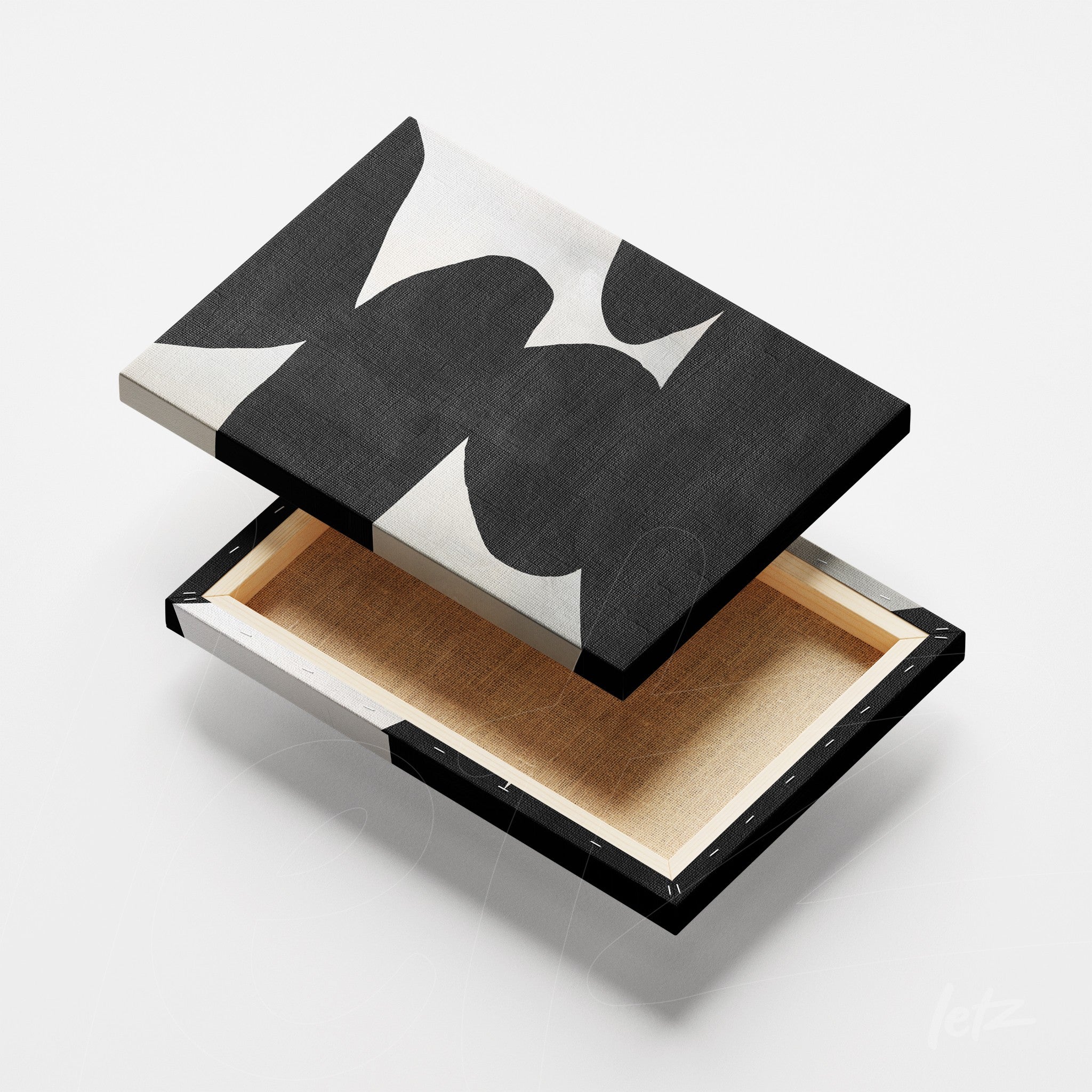 canvas artwork featuring abstract design in black and white with a thin frame