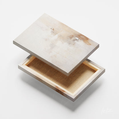 canvas print with subtle texture in beige and white tones displayed at an angle showing the frame