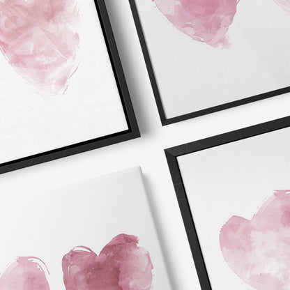 collection of framed art featuring watercolor hearts in pink and burgundy hues with thin black frames and white background