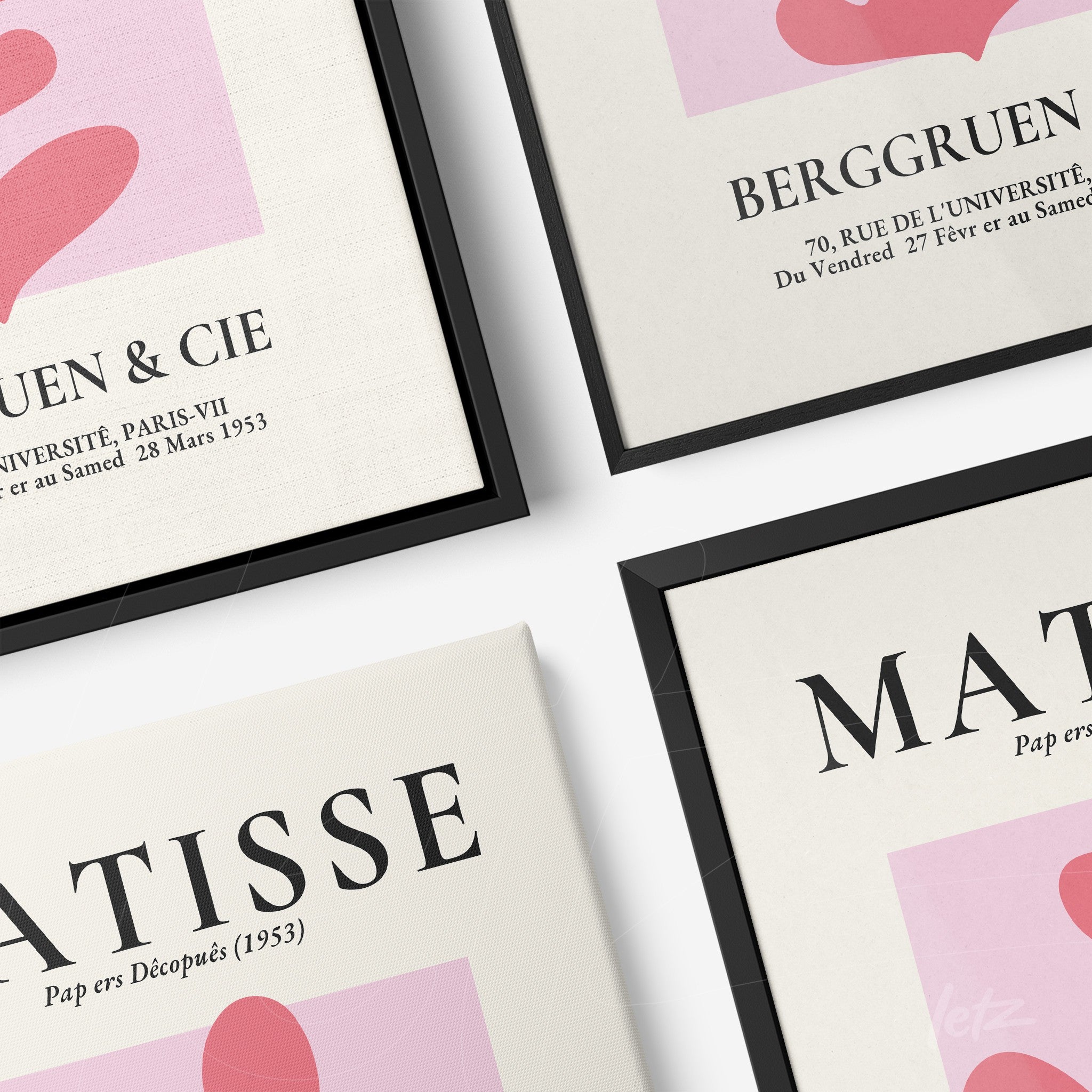 collection of modern art framed prints in black and white frames featuring abstract pink shapes and stylized text