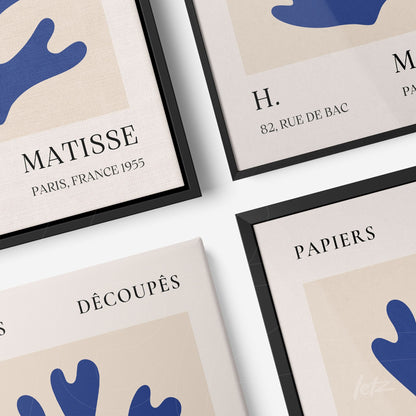 collection of modern wall art with light background, blue shapes and vintage typography, framed in black