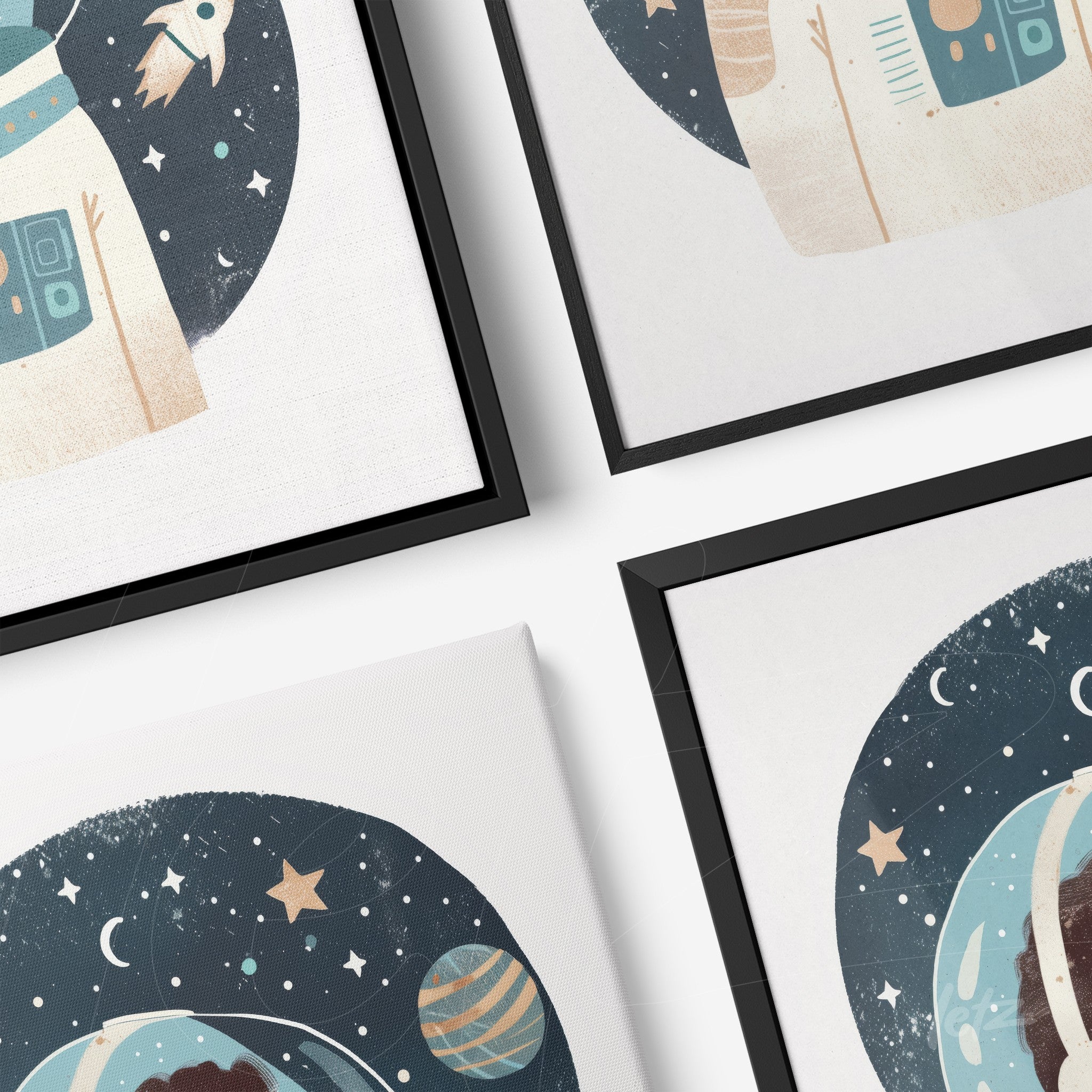 collection of four frames featuring space illustrations, including rockets and planets in black frames and canvas prints
