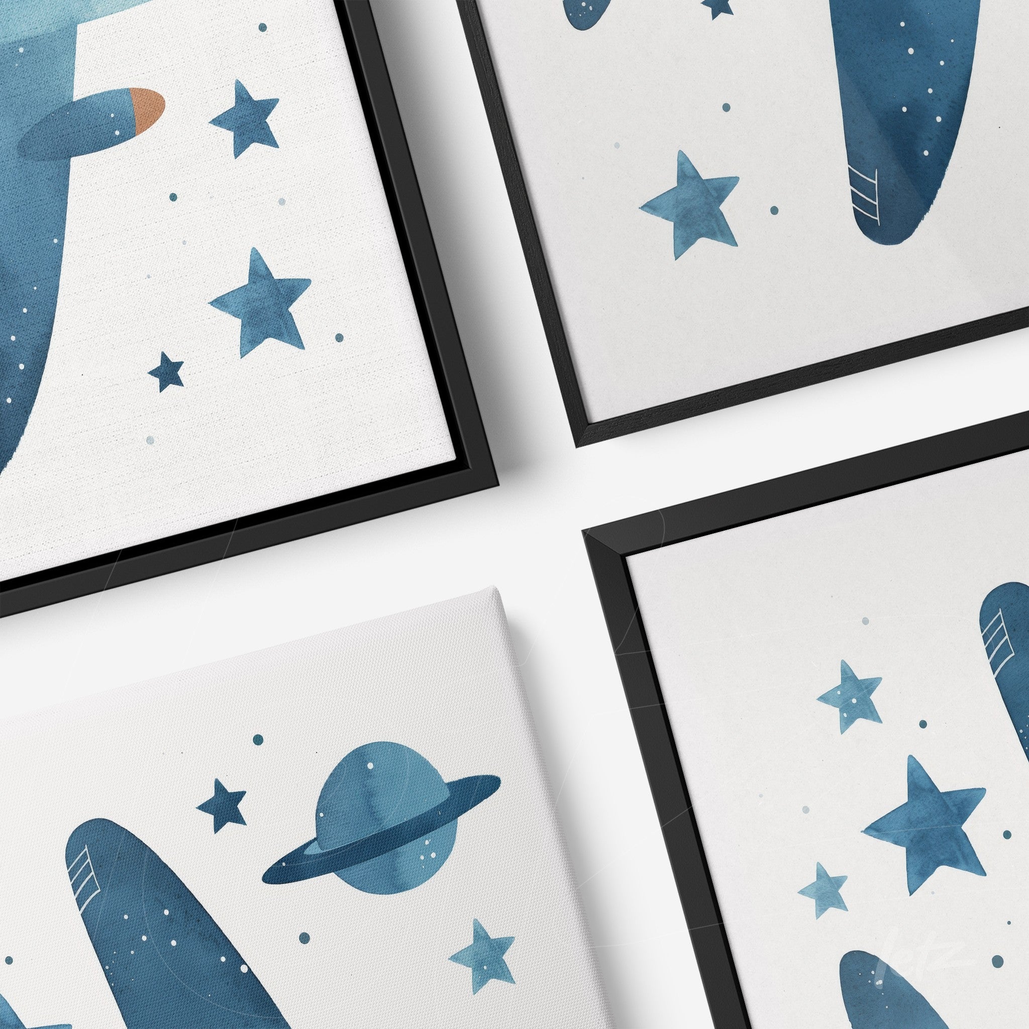 collection of framed wall art featuring watercolor illustrations of rockets and planets in blue tones with black frames