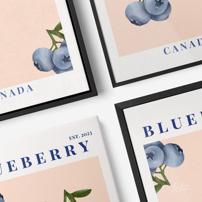 collection of framed wall art featuring blueberry illustrations on soft pink backgrounds with black and white frames