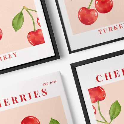 set of framed wall art featuring vintage style cherry illustrations with two black frames and one white frame, set against a soft background