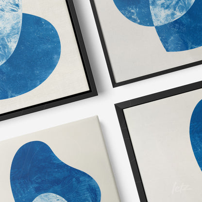 composition of wall art featuring abstract blue shapes on light backgrounds with thin black frames