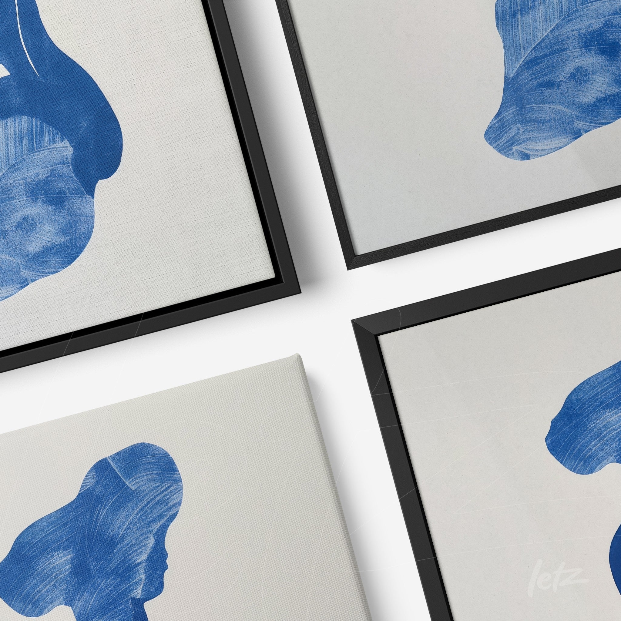 set of wall artworks featuring female silhouettes in blue tones, framed in black with light backgrounds