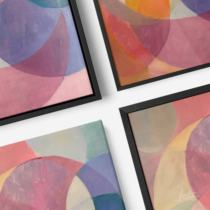 collection of framed abstract wall art featuring soft colors and black frames at an angle