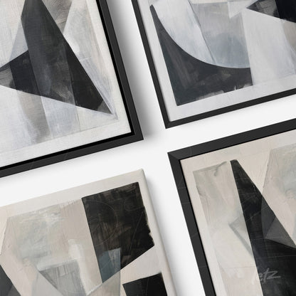 collection of abstract wall art in black, white, and gray with thin black frames