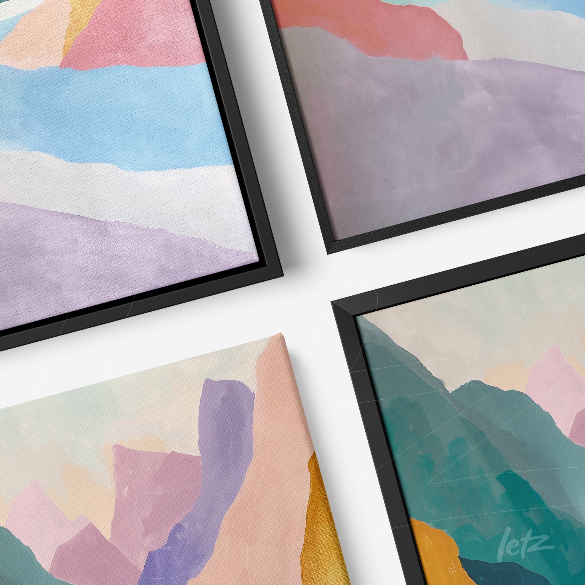 series of framed wall art featuring abstract mountains in soft shades of blue, pink, and purple with black frames
