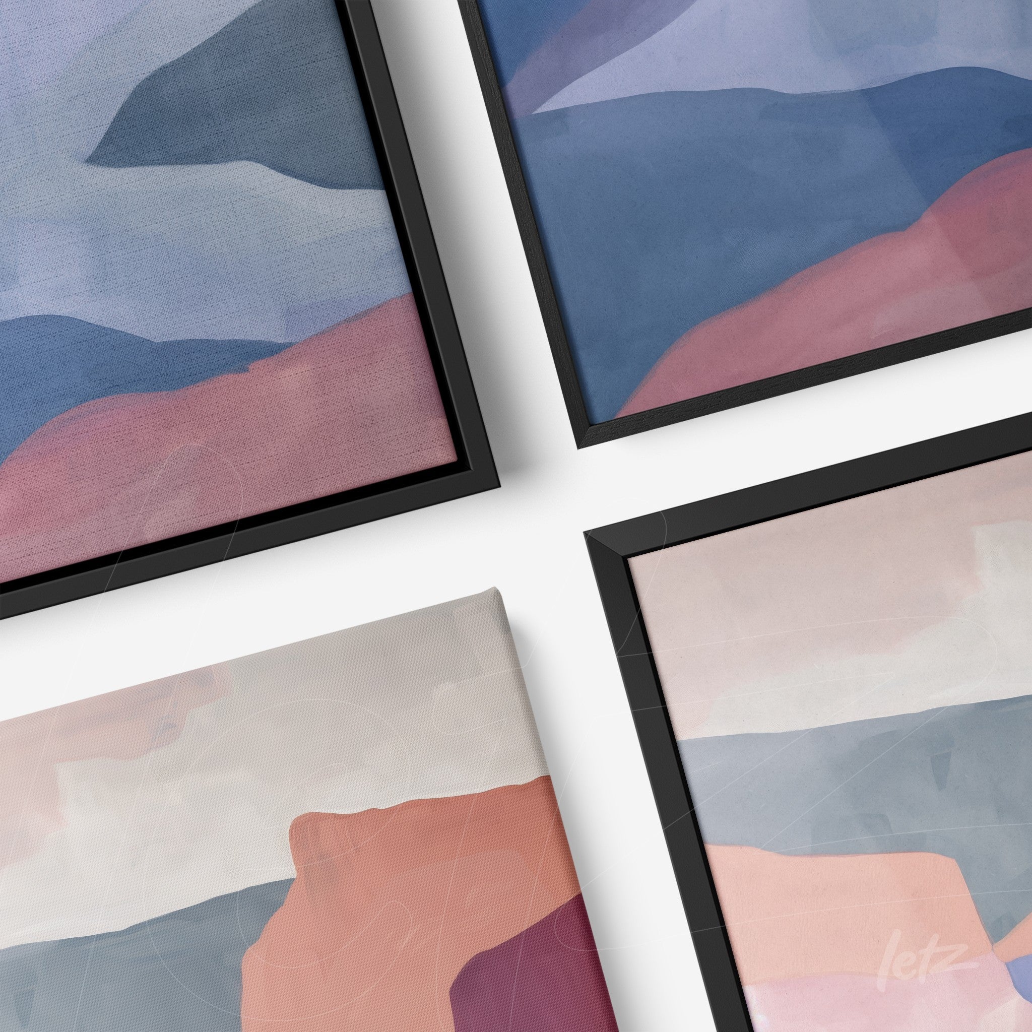collection of framed abstract wall art in shades of blue and pink with black frames