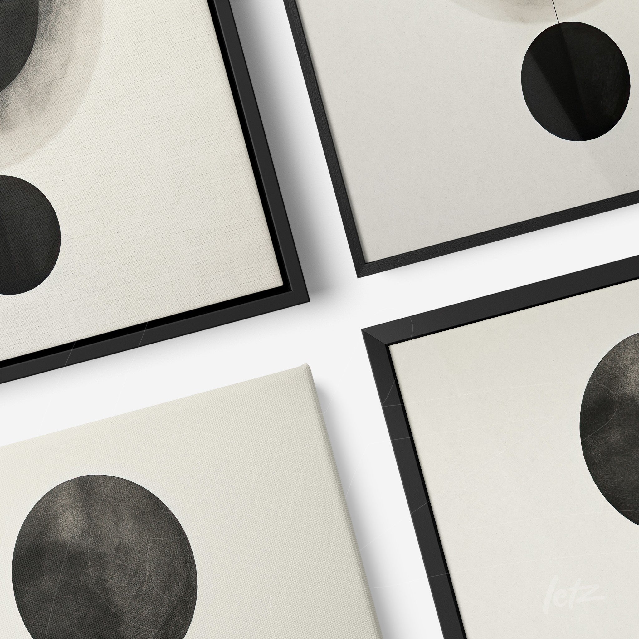 set of minimalistic wall art pieces featuring black circles on light background with slender black frames