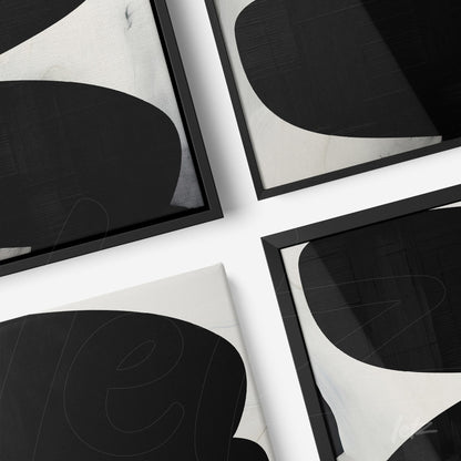 composition of framed wall art featuring abstract black and white shapes with black frames